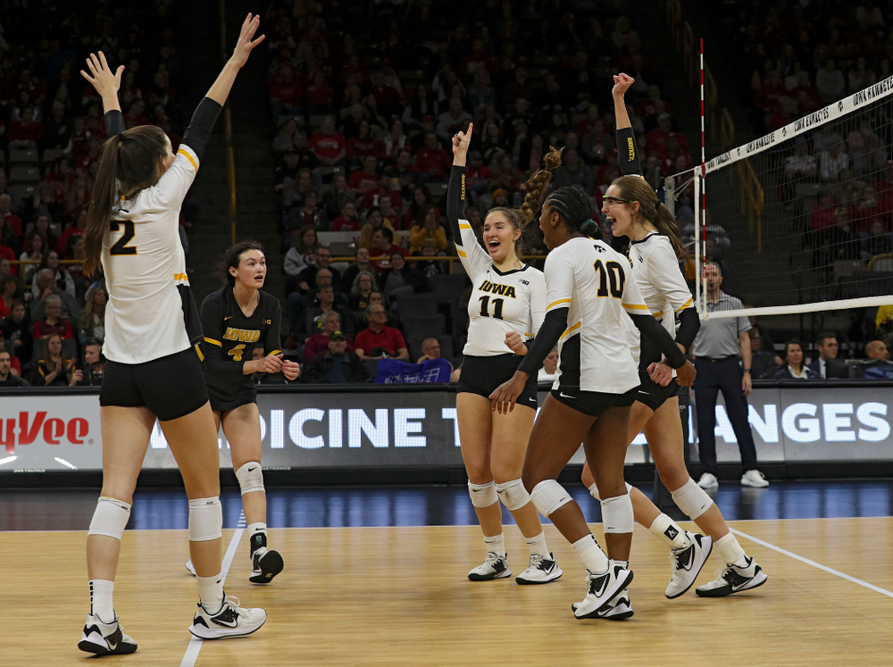Iowa’s Courtney Buzzerio (2), Halle Johnston (4), Blythe Rients (11), Griere Hughes (10), and Grace Tubbs (16) celebrate a score during the second set of their match against Nebraska at Carver-Hawkeye Arena in Iowa City on Saturday, Nov 9, 2019. (Stephen Mally/hawkeyesports.com)