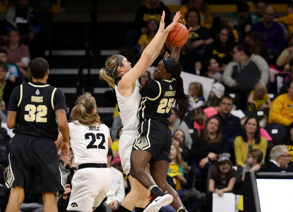 Iowa Hawkeyes forward Hannah Stewart (21) blocks a shot against the Purdue Boilermakers Sunday, January 27, 2019 at Carver-Hawkeye Arena. (Brian Ray/hawkeyesports.com)