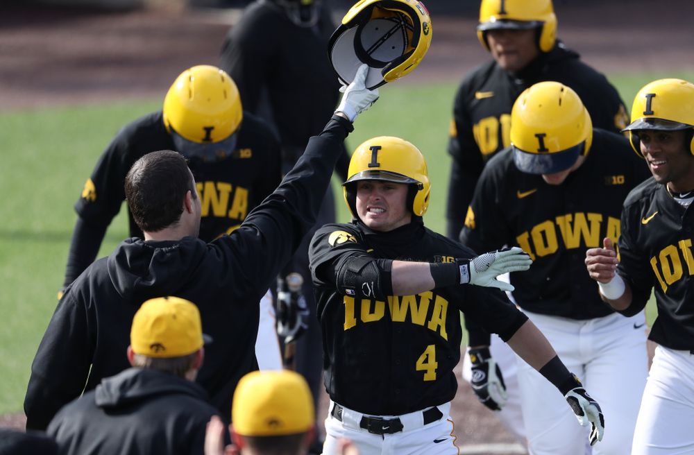 Iowa Hawkeyes infielder Mitchell Boe (4) reacts after hitting a game tying three-run homer against California State Northridge Sunday, March 17, 2019 at Duane Banks Field. (Brian Ray/hawkeyesports.com)