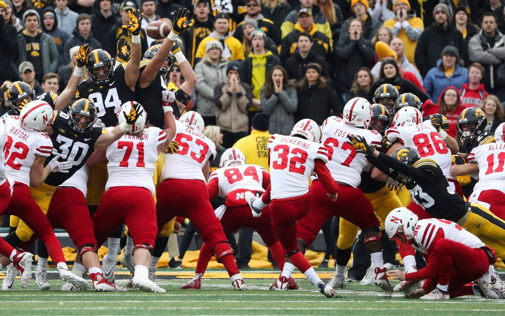 Iowa Hawkeyes defensive back Jake Gervase (30), Iowa Hawkeyes defensive end A.J. Epenesa (94) and Iowa Hawkeyes defensive end Anthony Nelson (98) try to block a field goal during a game against Nebraska at Kinnick Stadium on November 23, 2018. (Tork Mason/hawkeyesports.com)