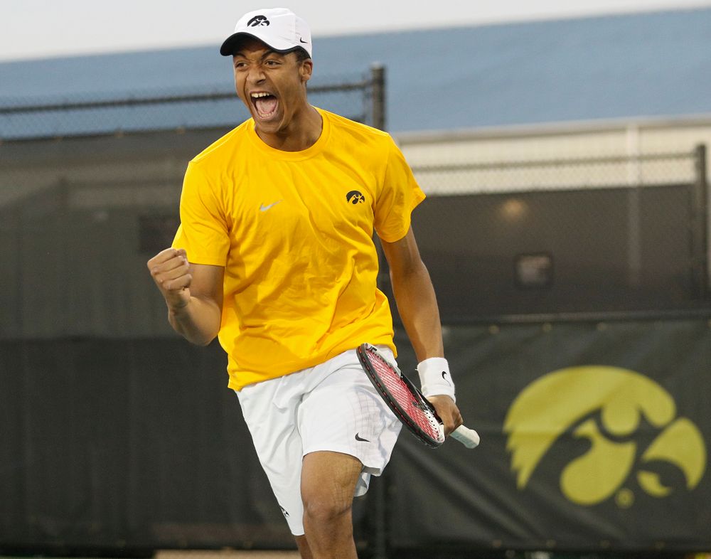 Iowa's Oliver Okonkwo celebrates a point during his match again Michigan State at the Hawkeye Tennis and Recreation Complex in Iowa City on Friday, Apr. 19, 2019. (Stephen Mally/hawkeyesports.com)