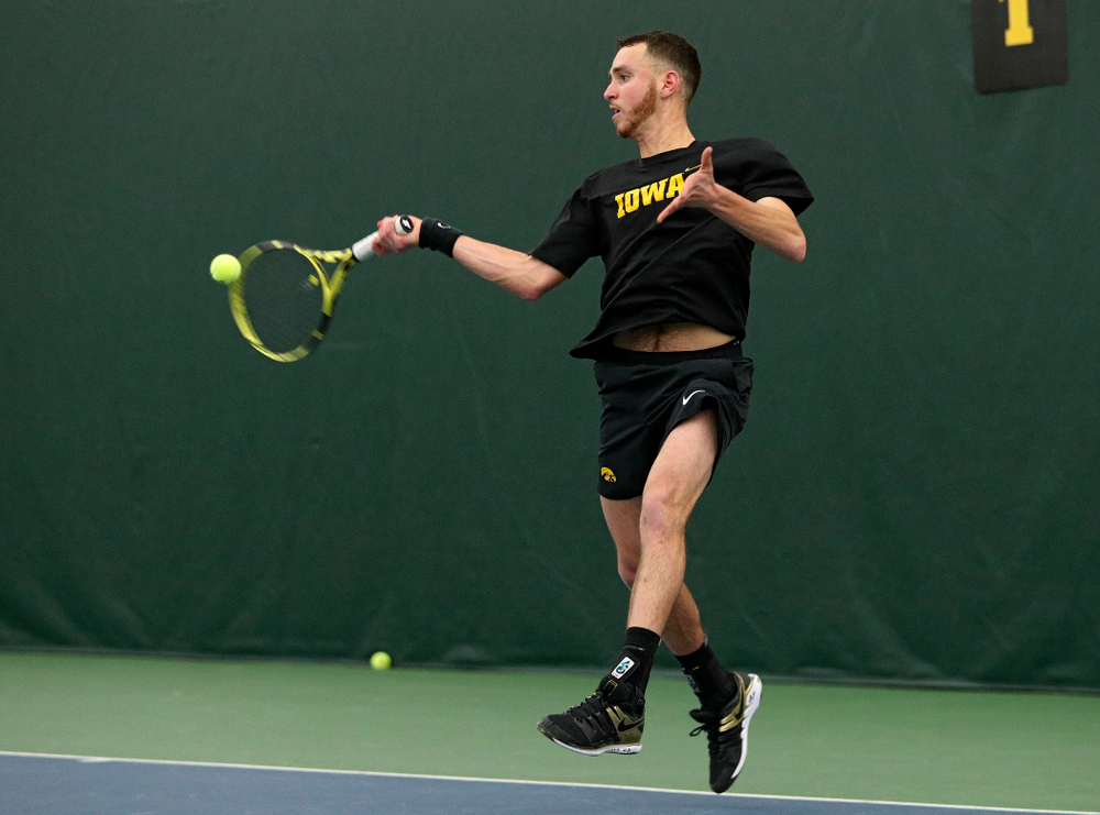 Iowa’s Kareem Allaf returns a shot during his singles match at the Hawkeye Tennis and Recreation Complex in Iowa City on Friday, March 6, 2020. (Stephen Mally/hawkeyesports.com)