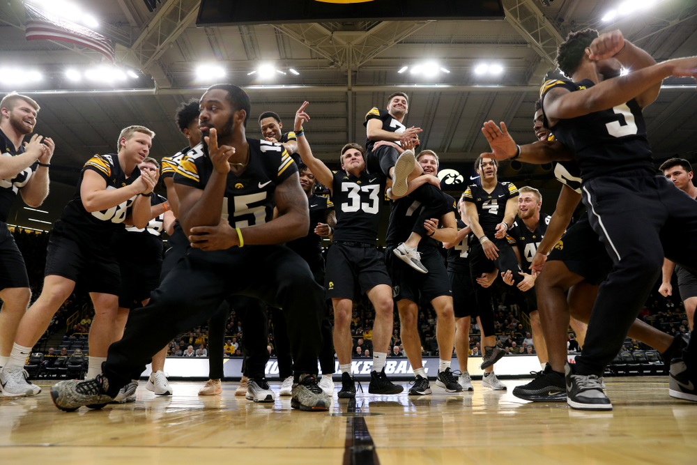 Members of the Hawkeye Football team performs with the Iowa Dance Team at halftime of the Iowa Hawkeyes game against the Ohio State Buckeyes Thursday, February 20, 2020 at Carver-Hawkeye Arena. (Brian Ray/hawkeyesports.com)