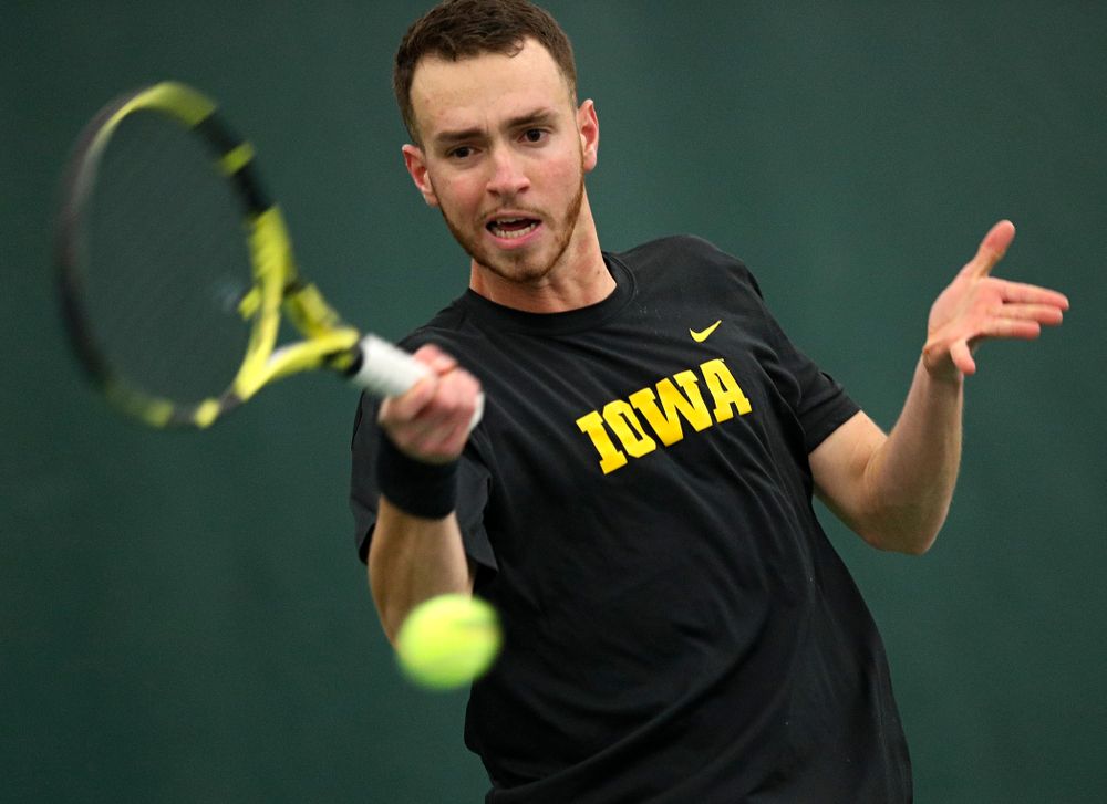 Iowa’s Kareem Allaf returns a shot during his singles match at the Hawkeye Tennis and Recreation Complex in Iowa City on Friday, March 6, 2020. (Stephen Mally/hawkeyesports.com)