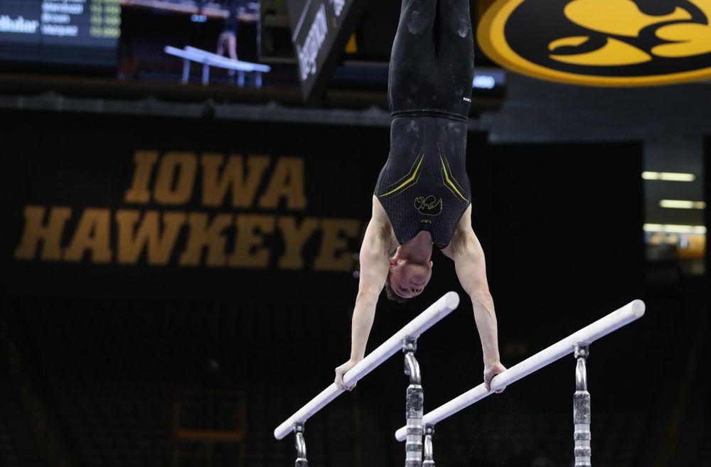 Iowa's Jake Brodarzon competes on the parallel bars against the Ohio State Buckeyes Saturday, March 16, 2019 at Carver-Hawkeye Arena. (Brian Ray/hawkeyesports.com)
