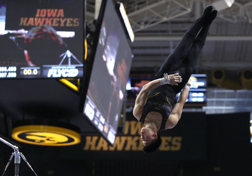 Iowa's Bennet Huang competes on the high bar against the Ohio State Buckeyes Saturday, March 16, 2019 at Carver-Hawkeye Arena. (Brian Ray/hawkeyesports.com)