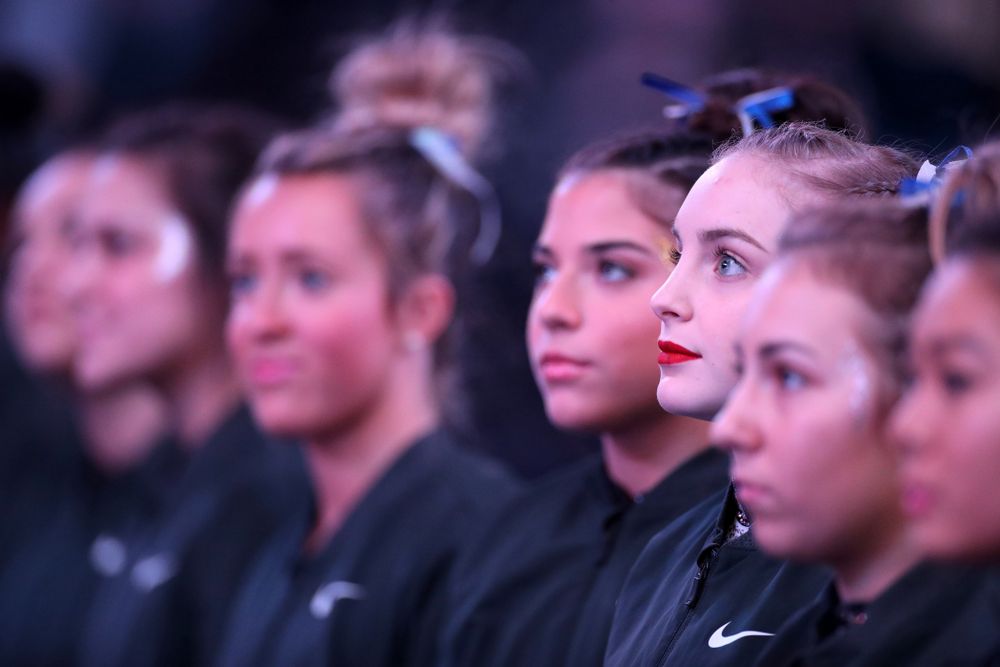 Iowa’s Lauren Guerin stands for the National Anthem before their meet against Michigan State Saturday, February 1, 2020 at Carver-Hawkeye Arena. (Brian Ray/hawkeyesports.com)