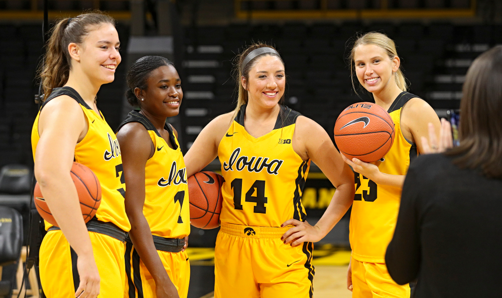 Iowa forward/center Paula Valiño Ramos (31), guard Tomi Taiwo (1), guard/forward McKenna Warnock (14), and forward Logan Cook (23) pose for a picture during Iowa Women’s Basketball Media Day at Carver-Hawkeye Arena in Iowa City on Thursday, Oct 24, 2019. (Stephen Mally/hawkeyesports.com)