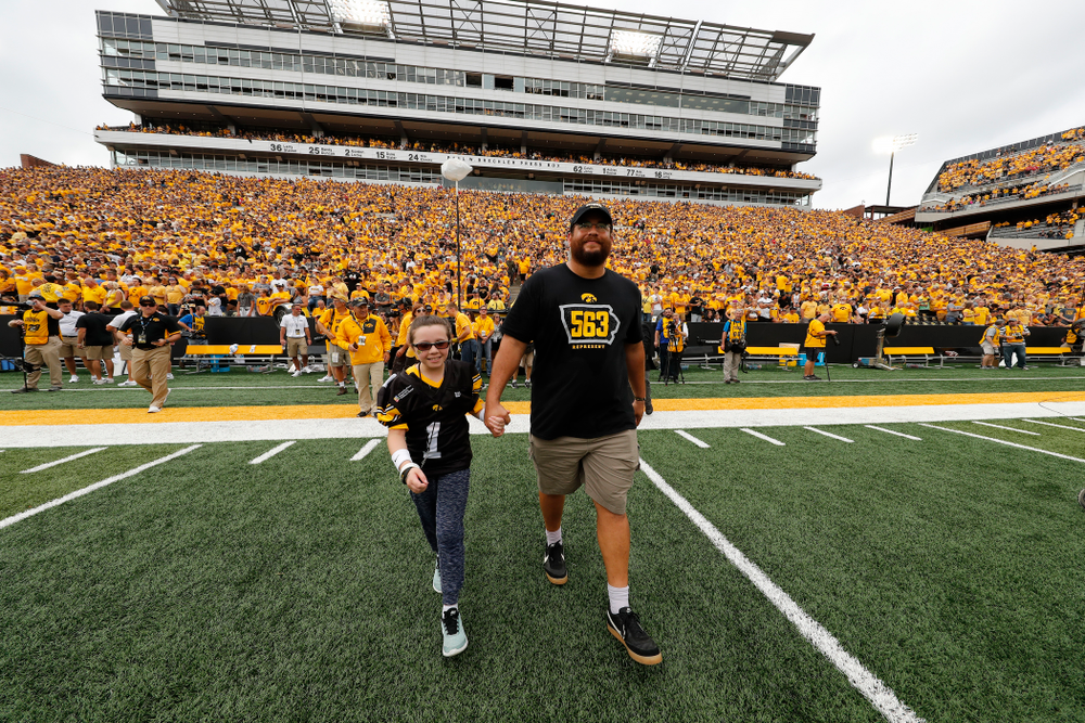 Honorary Captain Julian Vandervelde and the kid captain against the Northern Illinois Huskies Saturday, September 1, 2018 at Kinnick Stadium. (Brian Ray/hawkeyesports.com)