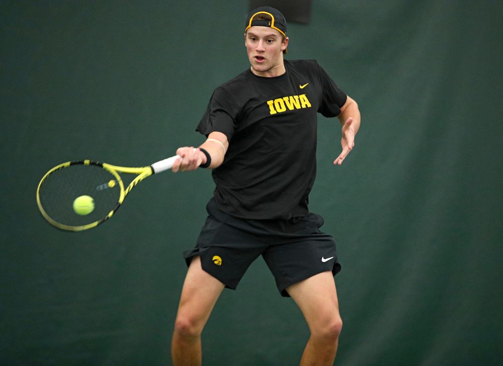 Iowa’s Joe Tyler hits a shot during his match against Marquette at the Hawkeye Tennis and Recreation Complex in Iowa City on Saturday, January 25, 2020. (Stephen Mally/hawkeyesports.com)