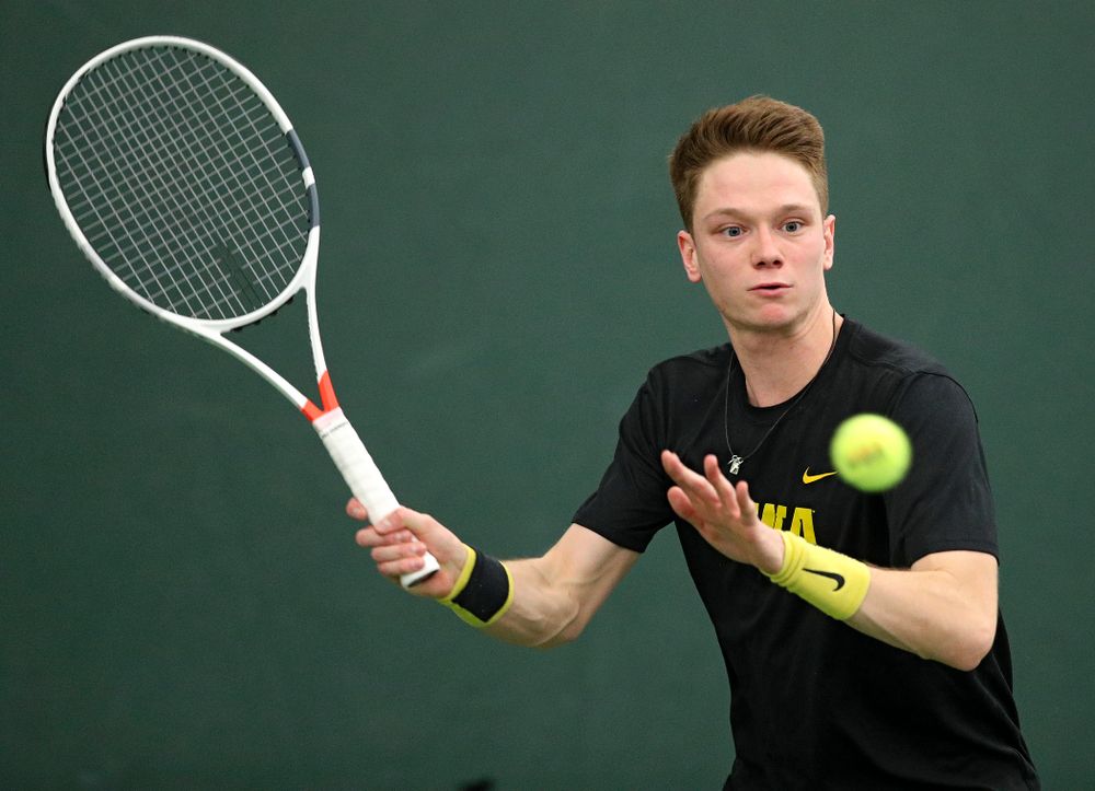 Iowa’s Jason Kerst returns a shot during his singles match at the Hawkeye Tennis and Recreation Complex in Iowa City on Friday, February 14, 2020. (Stephen Mally/hawkeyesports.com)