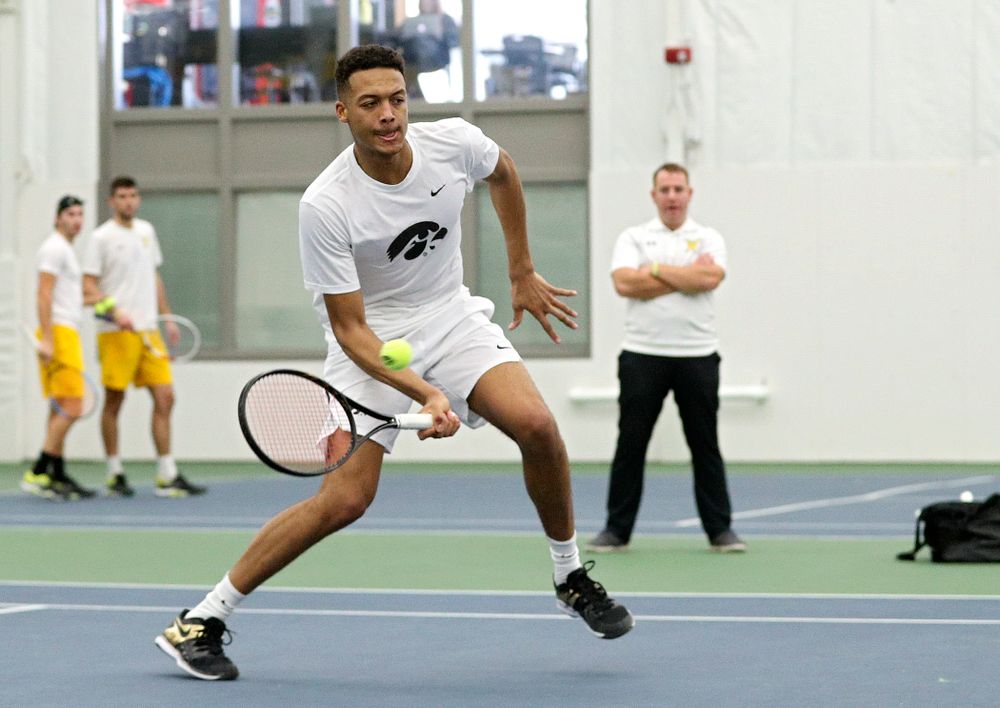 Iowa’s Oliver Okonkwo returns a shot during his doubles match at the Hawkeye Tennis and Recreation Complex in Iowa City on Sunday, February 16, 2020. (Stephen Mally/hawkeyesports.com)