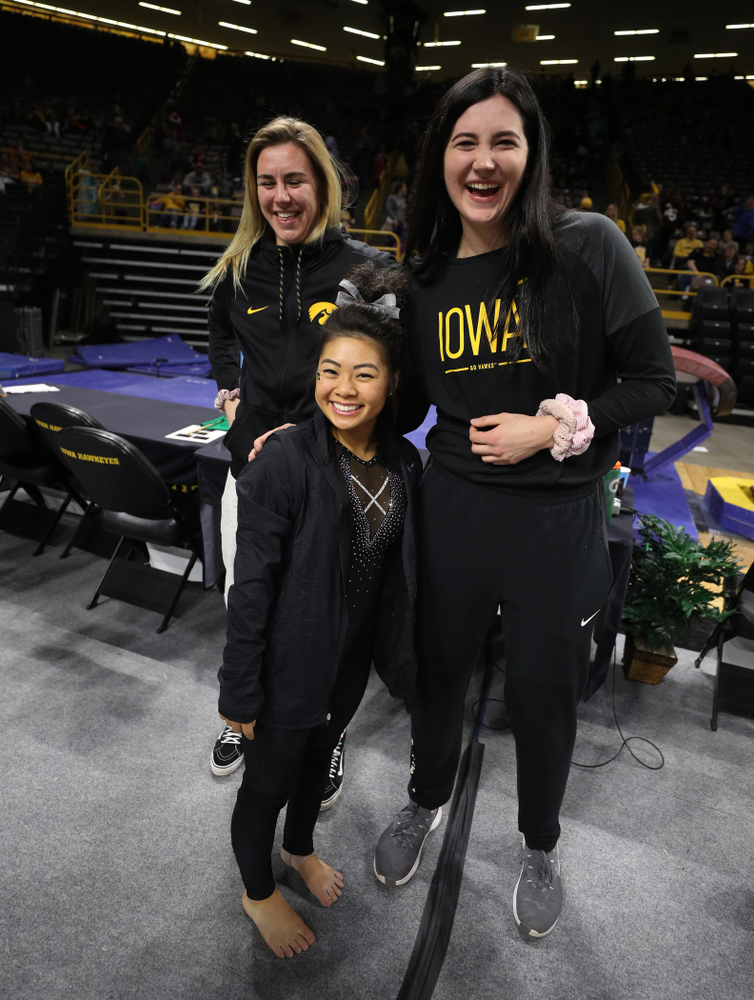 Iowa Women's Basketball seniors Megan Gustafson, Tania Davis, and forward Hannah Stewart (21) present the awards and dance the Cha Cha Slide following the Gymhawks meet against Illinois Saturday, February 16, 2019 at Carver-Hawkeye Arena. (Brian Ray/hawkeyesports.com)