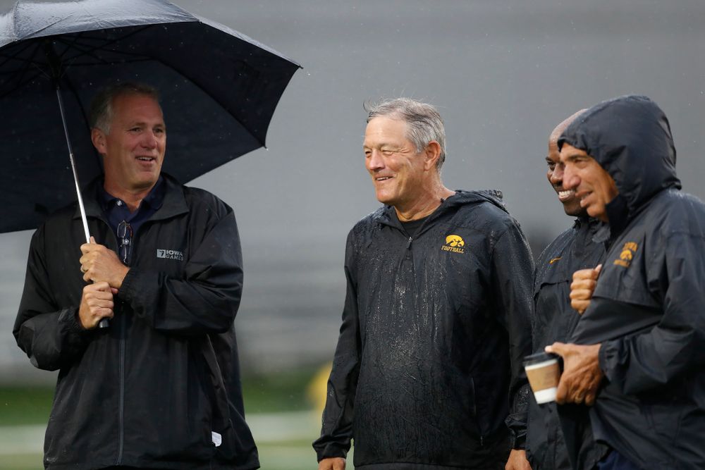 Iowa Hawkeyes head coach Kirk Ferentz talks with BTN's Gerry DiNardo, Howard Griffith, and Chuck Long during camp practice No. 15 Monday, August 20, 2018 at the Hansen Football Performance Center. (Brian Ray/hawkeyesports.com)
