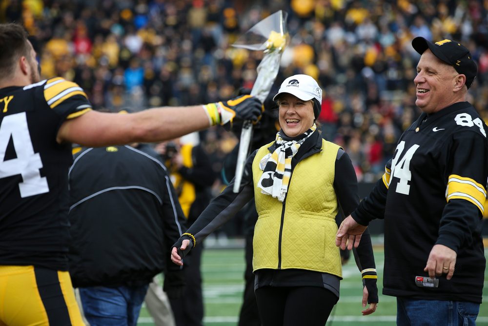 Iowa Hawkeyes wide receiver Nick Easley (84) is greeted by his parents during Senior Day ceremonies before a game against Nebraska at Kinnick Stadium on November 23, 2018. (Tork Mason/hawkeyesports.com)