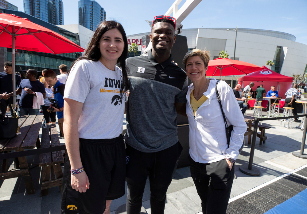 Iowa Hawkeyes forward Megan Gustafson (10) and associate head coach Jan Jensen take a photo with DukeÕs Zion Williamson Friday, April 12, 2019 during an event in the XBOX Plaza at LA Live. (Brian Ray/hawkeyesports.com)