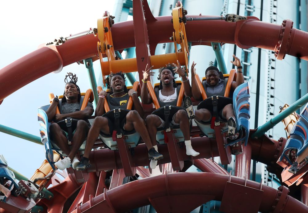 Iowa Hawkeyes defensive back Devonte Young (17), wide receiver Brandon Smith (12), wide receiver Ihmir Smith-Marsette (6), and and running backs coach Derrick Foster ride Falcon's Fury during an Outback Bowl team event Saturday, December 29, 2018 at Busch Gardens in Tampa, FL. (Brian Ray/hawkeyesports.com)