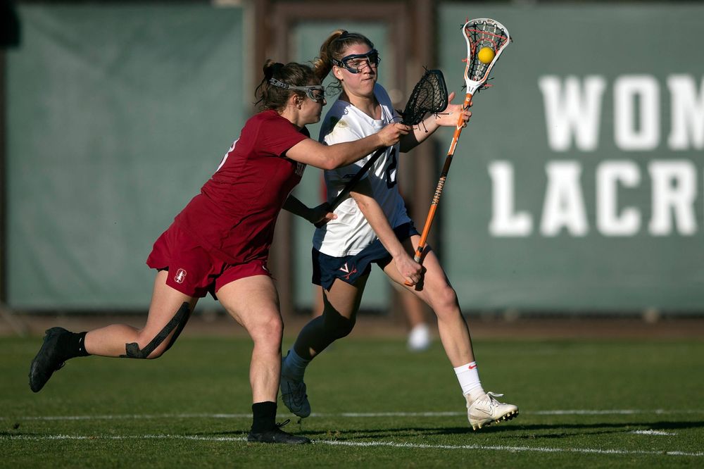 STANFORD, California - FEBRUARY 14: Virginia Cavaliers midfield Sammy Mueller (2) is defended by Stanford Cardinal defense Kyra Pelton (8) during the second half at Cagan Stadium on February 14, 2020 in Stanford, California. The Virginia Cavaliers defeated the Stanford Cardinal 12-11. (Photo by Jason O. Watson)