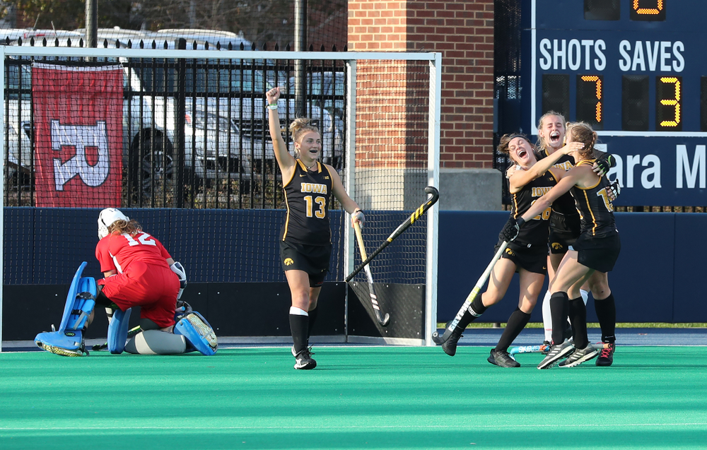 Iowa Hawkeyes forward Maddy Murphy (26), Katie Birch (11), Esme Gibson (15), and forward Leah Zellner (13) celebrate their game winning goal against Penn State in the 2019 Big Ten Field Hockey Tournament Championship Game Sunday, November 10, 2019 in State College. (Brian Ray/hawkeyesports.com)