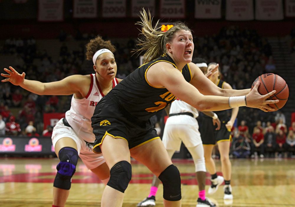 Iowa forward/center Monika Czinano (25) pulls in a pass during the first quarter of their game at the Rutgers Athletic Center in Piscataway, N.J. on Sunday, March 1, 2020. (Stephen Mally/hawkeyesports.com)