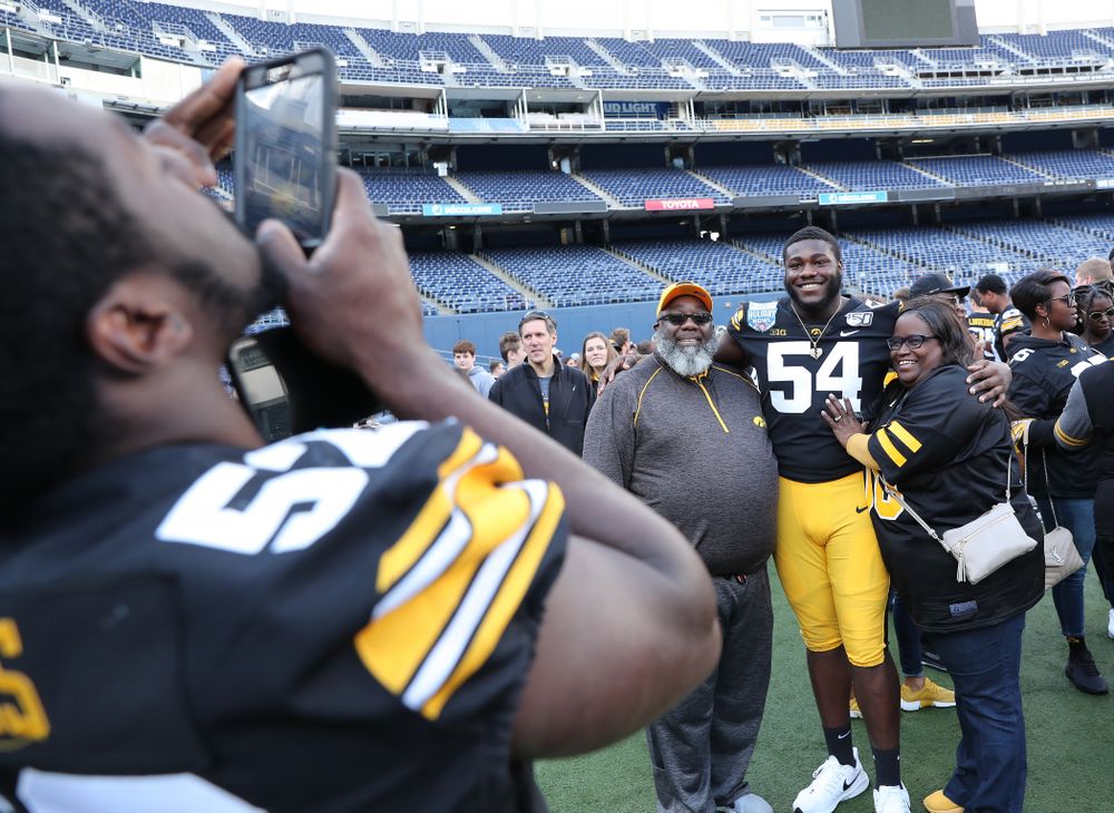 Iowa Hawkeyes defensive tackle Daviyon Nixon (54) following the team photo Wednesday, December 25, 2019 at SDCCU Stadium in San Diego. (Brian Ray/hawkeyesports.com)