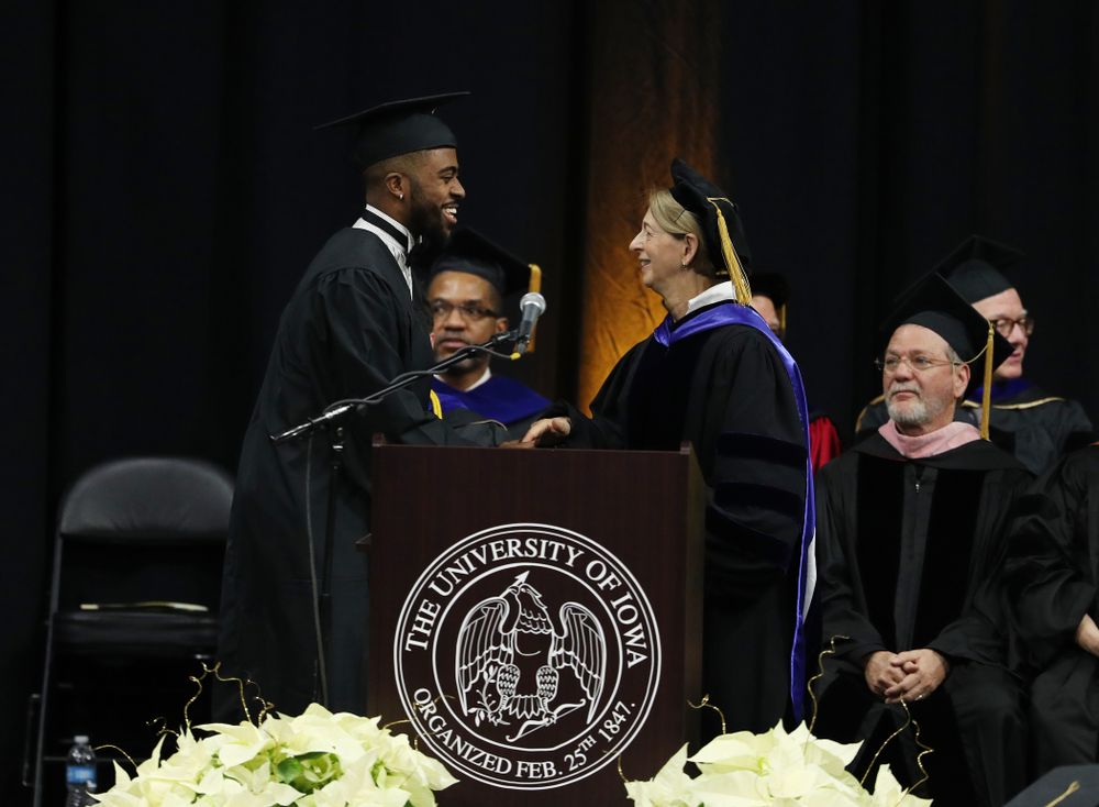 Iowa Track's Christian Brissett during the Fall Commencement Ceremony Saturday, December 15, 2018 at Carver-Hawkeye Arena. (Brian Ray/hawkeyesports.com)