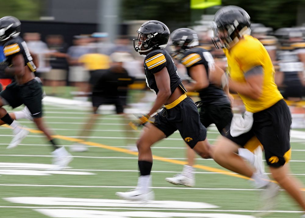 Iowa Hawkeyes wide receiver Tyrone Tracy Jr. (3) runs with his teammates as he warms up during Fall Camp Practice No. 15 at the Hansen Football Performance Center in Iowa City on Monday, Aug 19, 2019. (Stephen Mally/hawkeyesports.com)