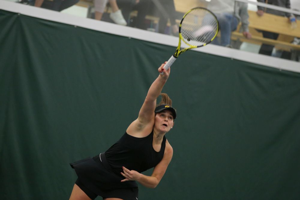 Iowa’s Danielle Bauers serves a ball during the Iowa women’s tennis meet vs UNI on Saturday, February 29, 2020 at the Hawkeye Tennis and Recreation Complex. (Lily Smith/hawkeyesports.com)
