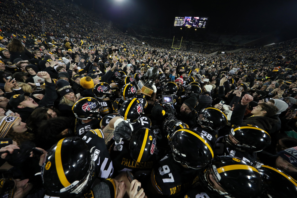 The Iowa Hawkeyes celebrate with the Floyd of Rosedale Trophy following their 23-19 victory over the Minnesota Golden Gophers Saturday, November 16, 2019 at Kinnick Stadium. (Brian Ray/hawkeyesports.com)