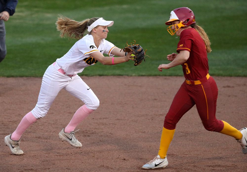 Iowa second baseman Aralee Bogar (2) tags out the runner as she turns a double play during the fifth inning of their game against Iowa State at Pearl Field in Iowa City on Tuesday, Apr. 9, 2019. (Stephen Mally/hawkeyesports.com)