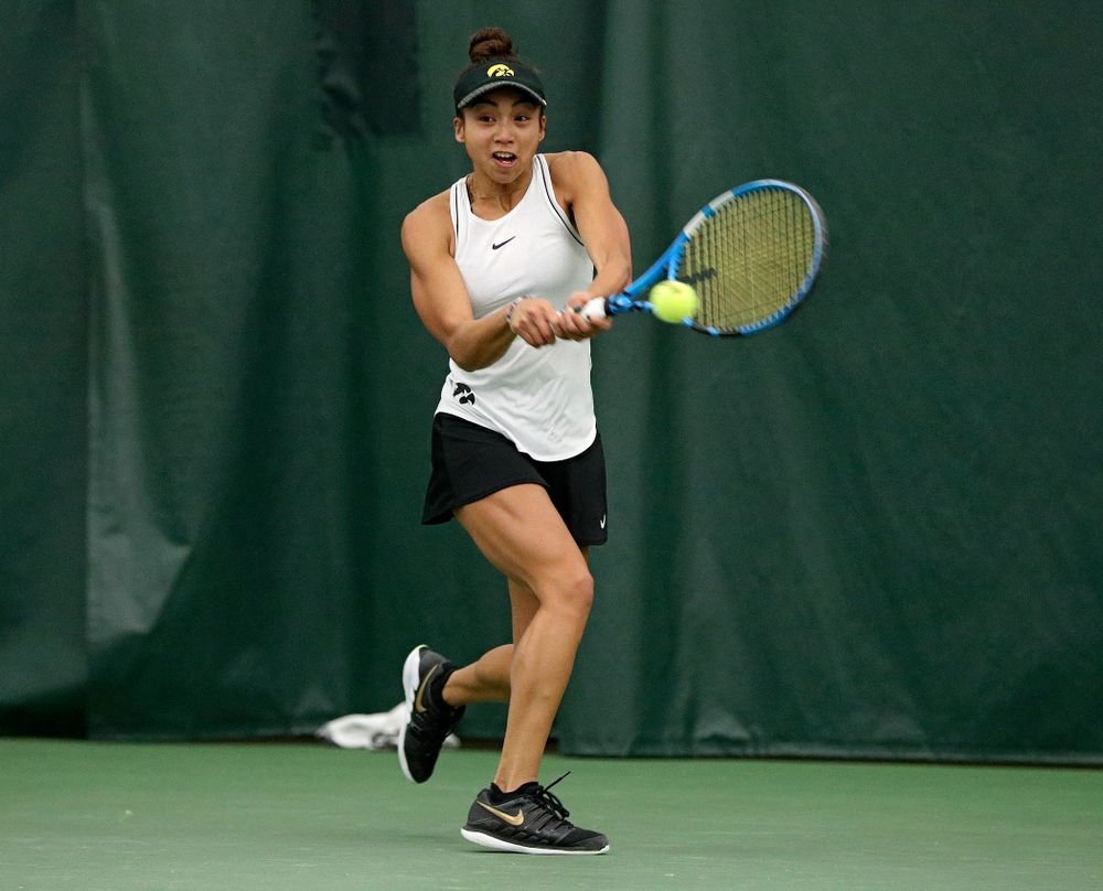 Iowa’s Michelle Bacalla returns a shot during her singles match at the Hawkeye Tennis and Recreation Complex in Iowa City on Sunday, February 16, 2020. (Stephen Mally/hawkeyesports.com)