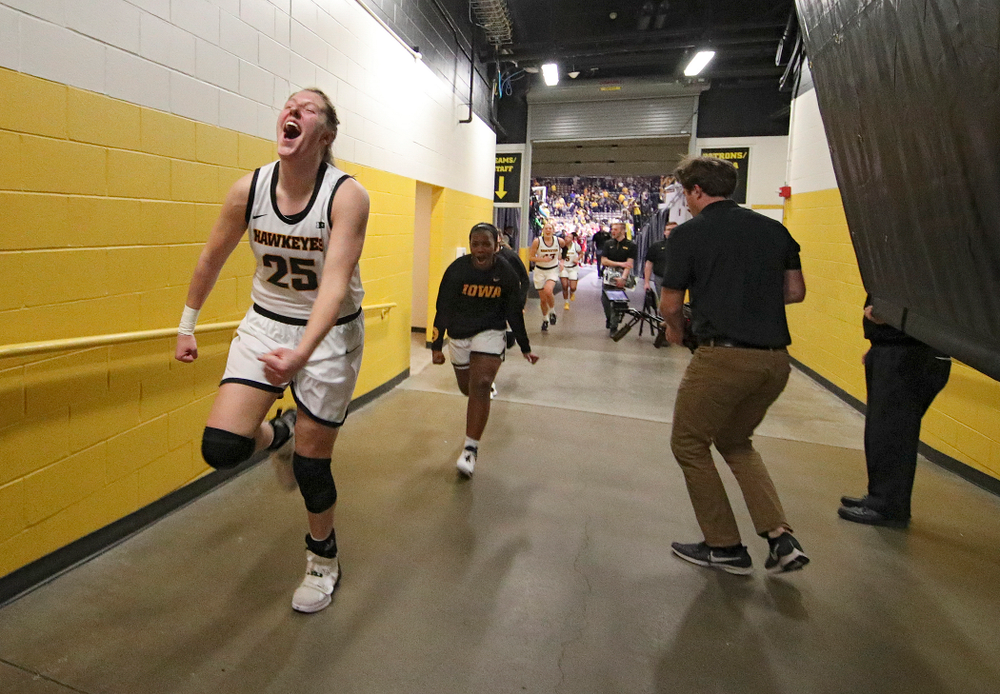 Iowa Hawkeyes forward Monika Czinano (25) celebrates as she runs back to the locker room after their double overtime win at Carver-Hawkeye Arena in Iowa City on Sunday, January 12, 2020. (Stephen Mally/hawkeyesports.com)
