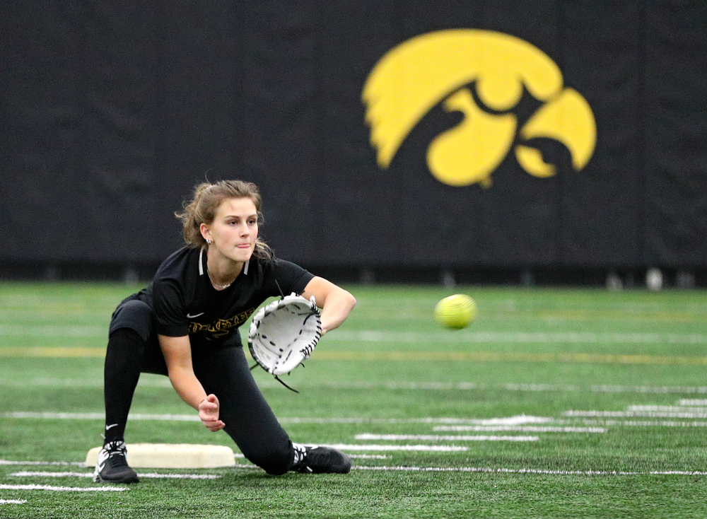 Iowa infielder Mia Ruther (26) pulls in a throw as they run a drill during Iowa Softball Media Day at the Hawkeye Tennis and Recreation Complex in Iowa City on Thursday, January 30, 2020. (Stephen Mally/hawkeyesports.com)