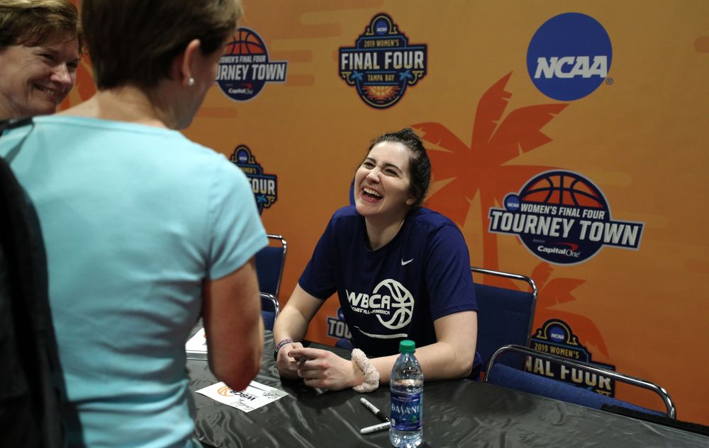 Iowa Hawkeyes forward Megan Gustafson (10) signs autographs with the other WBCA All Americans at the Tourney Town Fan Fest Friday, April 5, 2019 at the Tampa Convention Center in Tampa, FL. (Brian Ray/hawkeyesports.com)