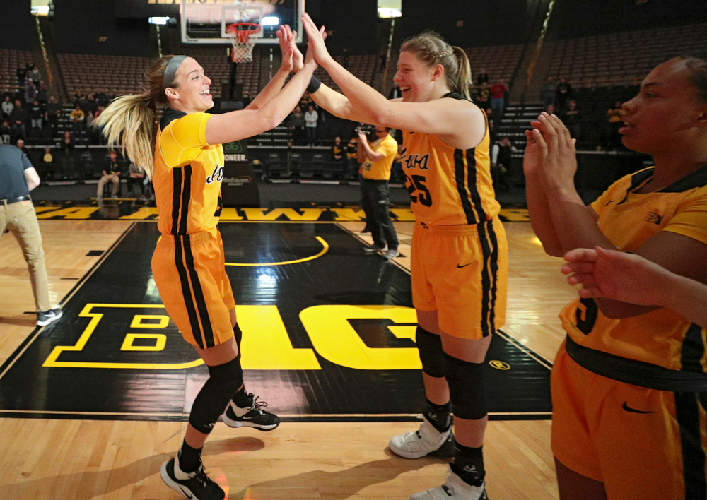 Iowa guard Makenzie Meyer (3) gets a high-five from forward/center Monika Czinano (25) as she is introduced before their game against Winona State at Carver-Hawkeye Arena in Iowa City on Sunday, Nov 3, 2019. (Stephen Mally/hawkeyesports.com)