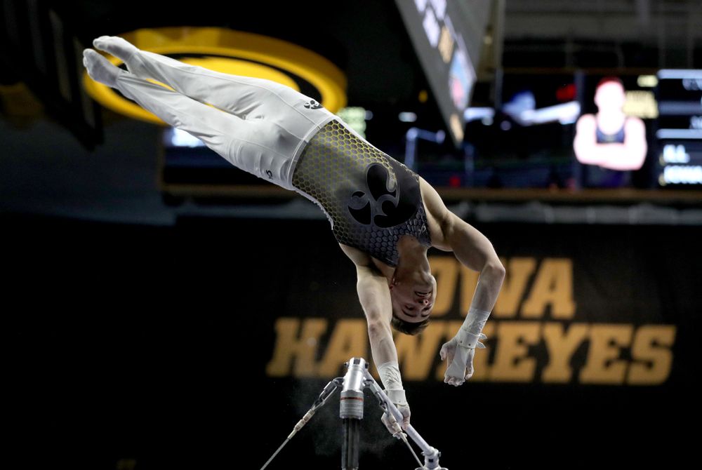 Iowa’s Mitch Mandozzi competes on the high bar against Illinois Sunday, March 1, 2020 at Carver-Hawkeye Arena. (Brian Ray/hawkeyesports.com)
