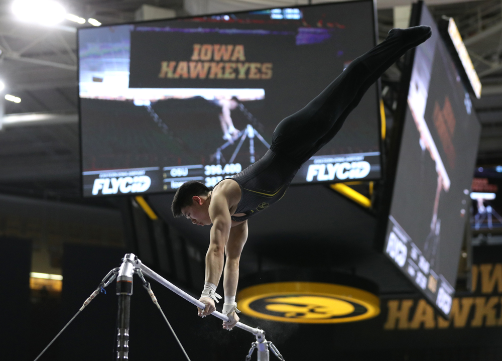 Iowa's Bennet Huang competes on the high bar against the Ohio State Buckeyes Saturday, March 16, 2019 at Carver-Hawkeye Arena. (Brian Ray/hawkeyesports.com)