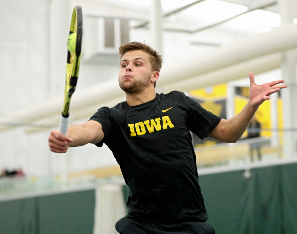 Iowa’s Will Davies returns a shot during his doubles match at the Hawkeye Tennis and Recreation Complex in Iowa City on Thursday, January 16, 2020. (Stephen Mally/hawkeyesports.com)
