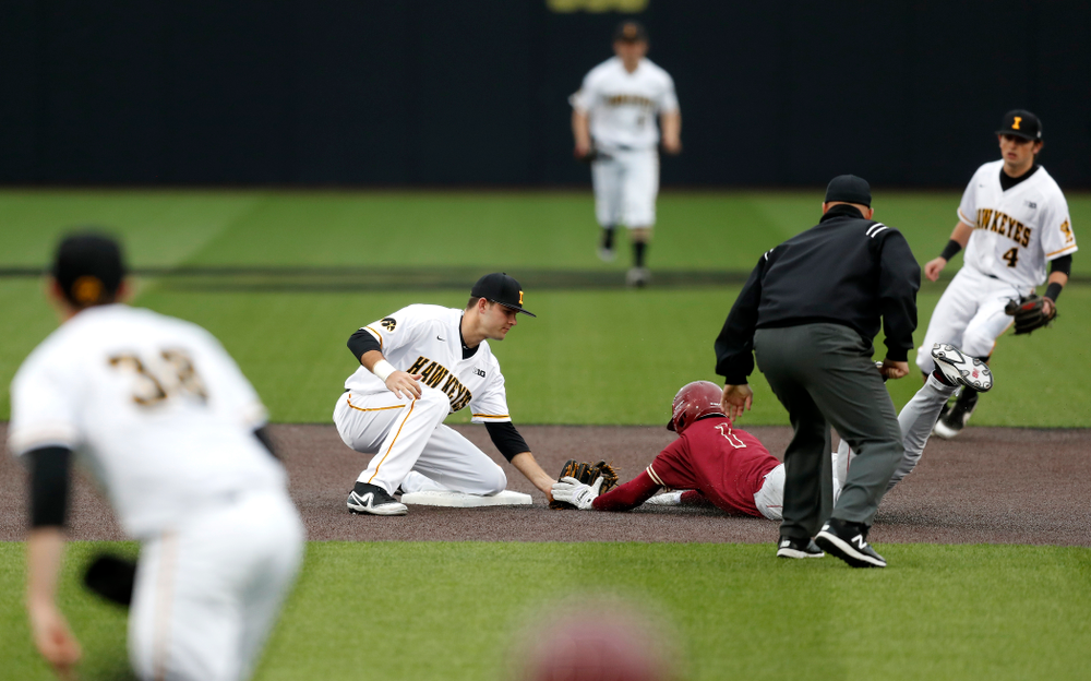 Iowa Hawkeyes infielder Kyle Crowl (23) tags a runner out at second against Coe College Wednesday, April 11, 2018 at Duane Banks Field. (Brian Ray/hawkeyesports.com)