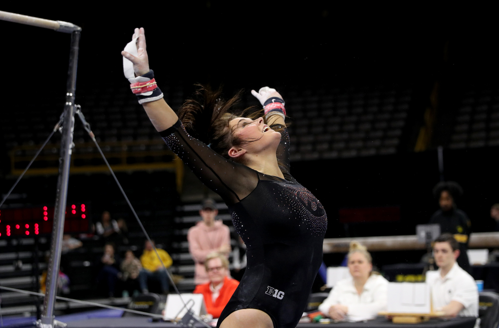 Iowa’s Erin Castle competes on the bars against Michigan Friday, February 14, 2020 at Carver-Hawkeye Arena. (Brian Ray/hawkeyesports.com)