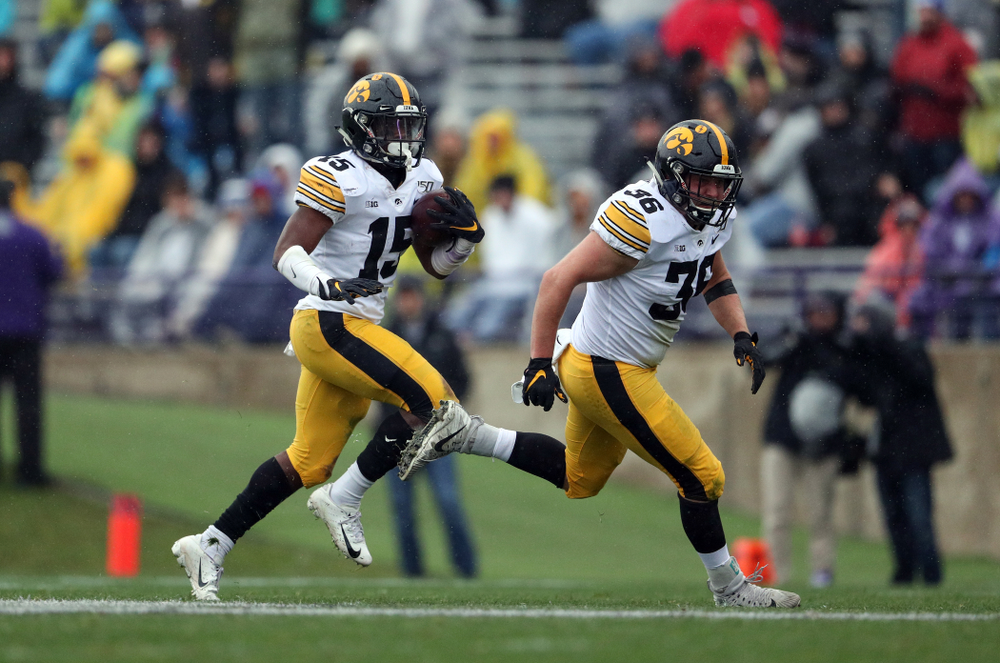 Iowa Hawkeyes running back Tyler Goodson (15) and fullback Brady Ross (36) against the Northwestern Wildcats Saturday, October 26, 2019 at Ryan Field in Evanston, Ill. (Brian Ray/hawkeyesports.com)