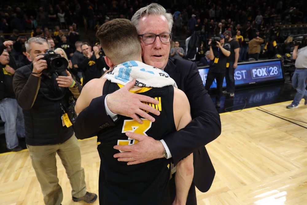 Iowa Hawkeyes guard Jordan Bohannon (3) hugs Iowa Hawkeyes head coach Fran McCaffery after defeating the Indiana Hoosiers in overtime Friday, February 22, 2019 at Carver-Hawkeye Arena. (Brian Ray/hawkeyesports.com)