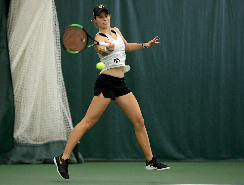 Iowa’s Elise Van Heuvelen returns a shot during her singles match at the Hawkeye Tennis and Recreation Complex in Iowa City on Sunday, February 23, 2020. (Stephen Mally/hawkeyesports.com)