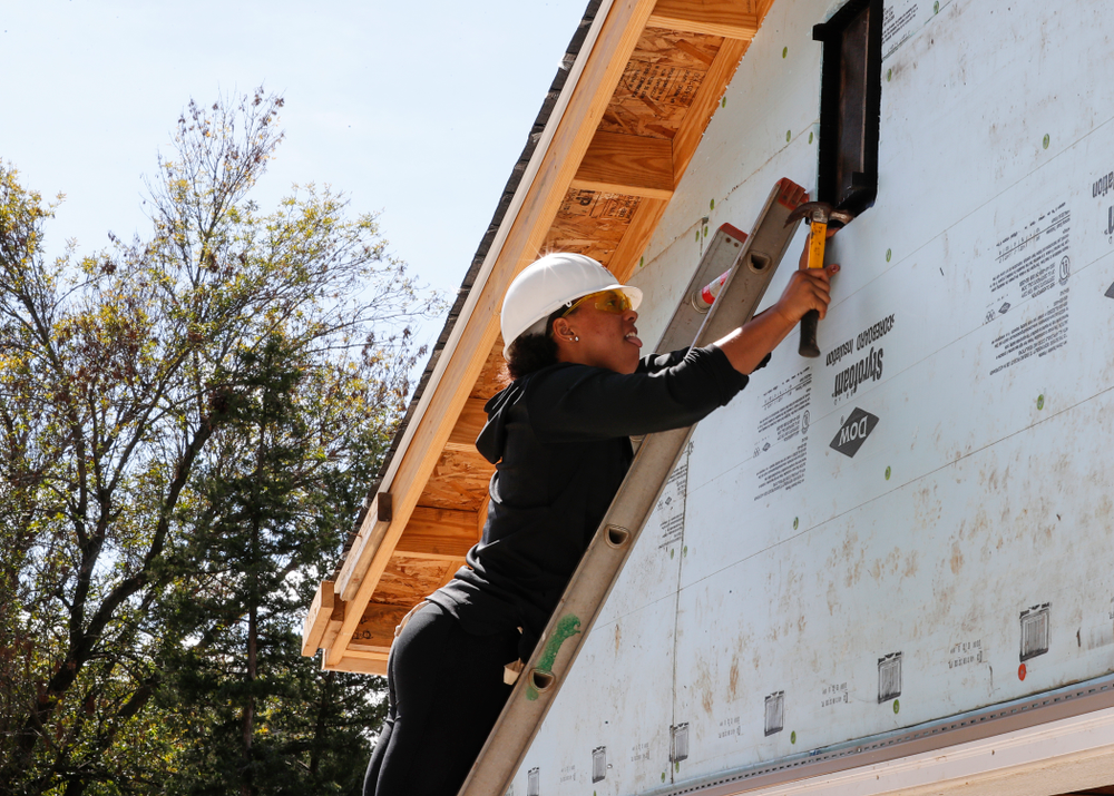 Iowa Hawkeyes guard Alexis Sevillian (5) works on the Habitat for Humanity Women's Build Wednesday, September 26, 2018 in Iowa City. (Brian Ray/hawkeyesports.com)