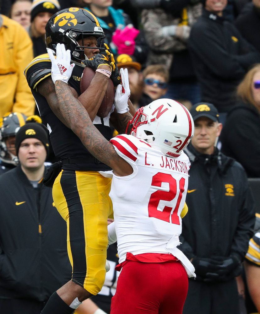 Iowa Hawkeyes wide receiver Brandon Smith (12) makes a first down reception during a game against Nebraska at Kinnick Stadium on November 23, 2018. (Tork Mason/hawkeyesports.com)