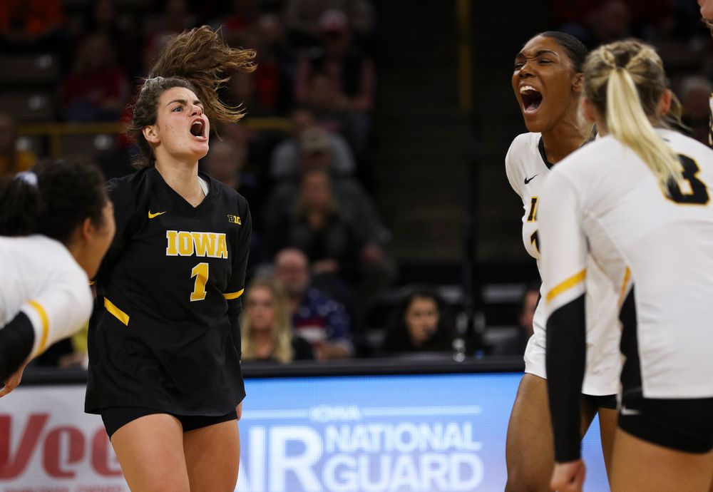 Iowa Hawkeyes defensive specialist Molly Kelly (1) and Iowa Hawkeyes outside hitter Taylor Louis (16) celebrate after winning a point during a match against Nebraska at Carver-Hawkeye Arena on November 7, 2018. (Tork Mason/hawkeyesports.com)