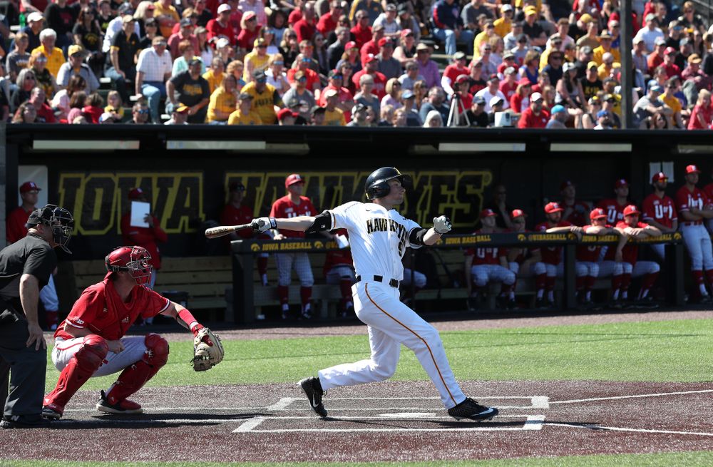 Iowa Hawkeyes outfielder Ben Norman (9) hits a home run against the Nebraska Cornhuskers Saturday, April 20, 2019 at Duane Banks Field. (Brian Ray/hawkeyesports.com)