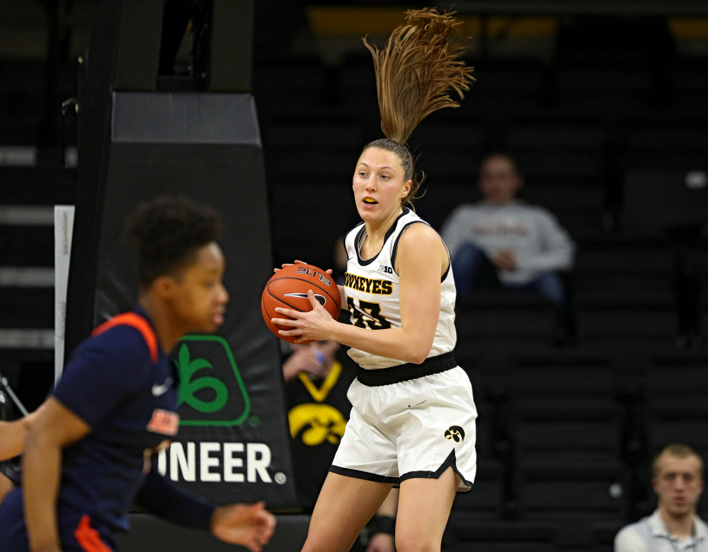 Iowa Hawkeyes forward Amanda Ollinger (43) pulls down a rebound during the third quarter of their game at Carver-Hawkeye Arena in Iowa City on Tuesday, December 31, 2019. (Stephen Mally/hawkeyesports.com)