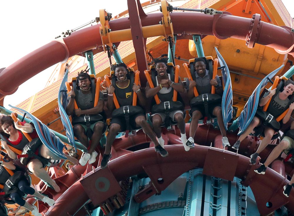 Iowa Hawkeyes defensive back Devonte Young (17), wide receiver Brandon Smith (12), wide receiver Ihmir Smith-Marsette (6), and and running backs coach Derrick Foster ride Falcon's Fury during an Outback Bowl team event Saturday, December 29, 2018 at Busch Gardens in Tampa, FL. (Brian Ray/hawkeyesports.com)