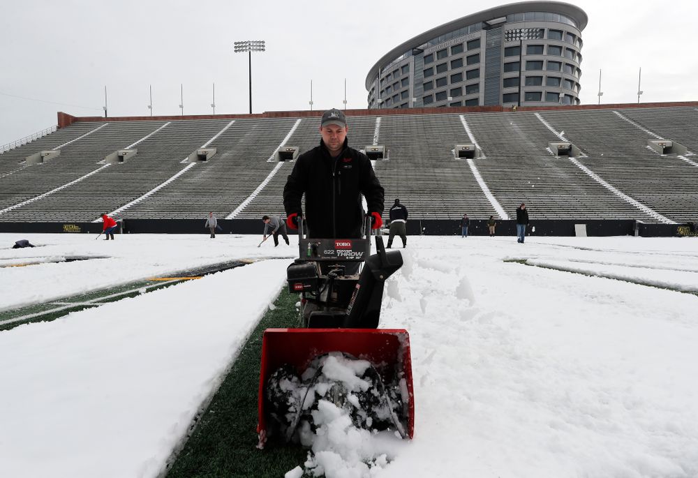 Members of the Iowa Athletics Turf Management staff create the #SnowWave for kids in the Stead Family Children's Hospital Thursday, February